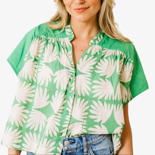 Green floral button front top relaxed fit lightweight blouse front view styled with denim jeans