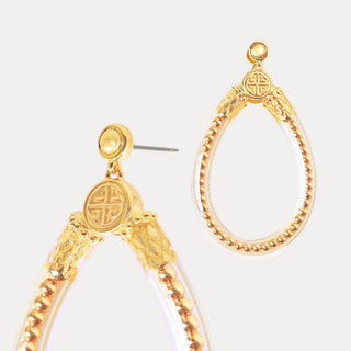 BudhaGirl Gold Bibi All Weather Earrings clear teardrop statement earrings with gold hardware angled product view