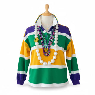 Colorful striped sweater on a mannequin with beads draped over and a gold Louisiana necklace on a white background