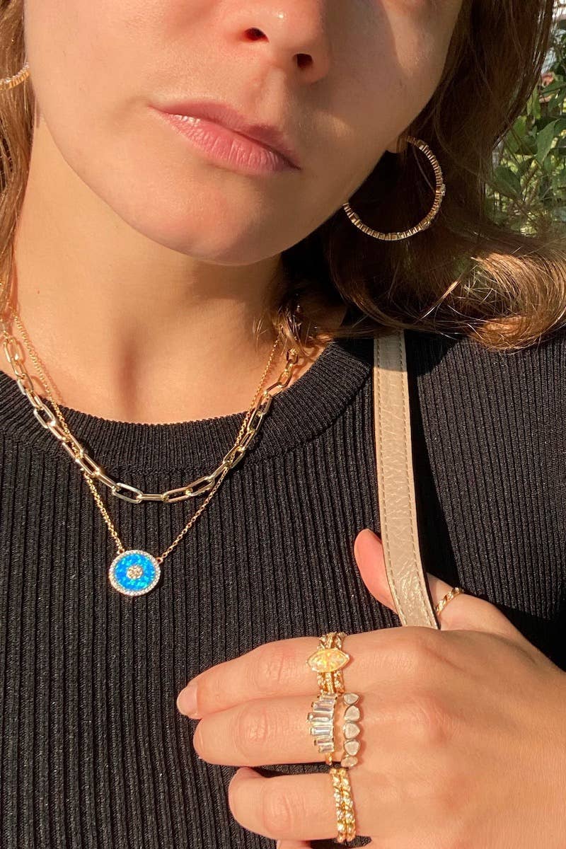 The Native Gem Gia is a dainty hand wire wrapped moonstone is connected to a paperclip chain that looks stunning with any outfit. 