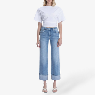 Light wash cuffed slim wide leg jeans front view.