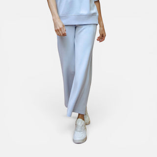 Light blue scuba knit cropped wide leg pants with pull-on waistband shown on model front view