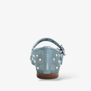Blue mary jane with studded details on a white background