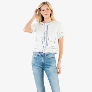 Contrast stitch knit button up top with short sleeves, decorative buttons, and tailored pockets in red or white