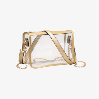Clear crossbody bag with gold trim and gold chain accents