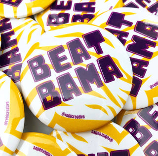LSU game day button with Play Neck text, purple and gold burst design, and band graphic front view