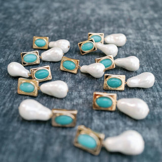 Turquoise and pearl drop earrings with gold accents and oversized pearl design front product view