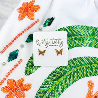 Butterfly earrings on a card with 'hoity toity boutique' branding, surrounded by decorative beads and flowers.