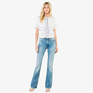 Contrast stitch knit button up top with short sleeves, decorative buttons, and tailored pockets in red or white