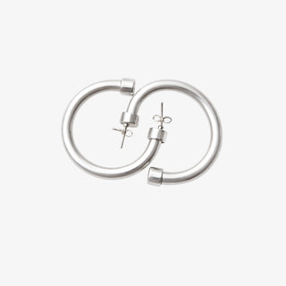 Medium brushed silver hoop earrings with matte metallic finish front product view