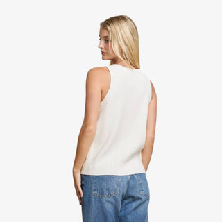 Woman wearing ivory sequin ribbed tank top with round neck and slim fit