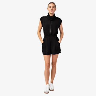 Black romper with sleeveless scuba fabric, half zip neckline, elastic waist, and front pockets for casual outfits front view