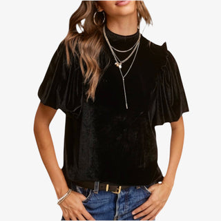 Woman wearing Velvet Whisper Jet Black Top with flutter sleeves and mock neckline