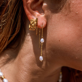 Gold threader earrings with freshwater pearls dangling from a delicate chain