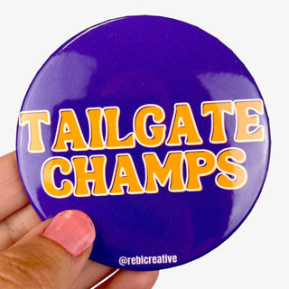 Tailgate Champs button in purple with gold lettering for LSU game day fans
