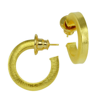 Betty Carre Fifi gold-plated hoop earrings with a brushed matte finish and rounded open-hoop design