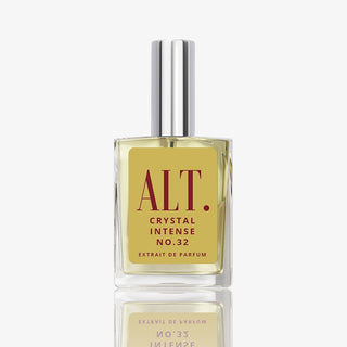 Clear bottle of ALT. Crystal Intense No. 32 perfume with gold label and silver cap on white background