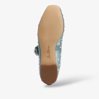 Light blue shoe with brown sole on a white background