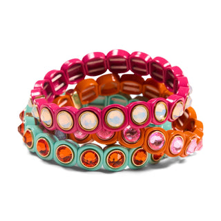 Colorful stack of beaded stretch bracelets with gem details in pink, orange, and teal