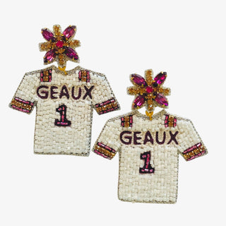 Pair of earrings shaped like beaded jerseys with 'GEAUX' and number '1' on a white background