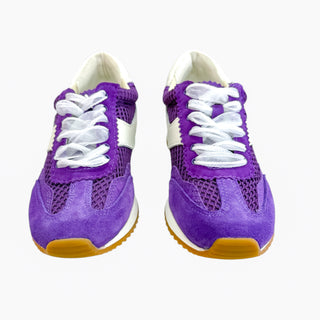 Purple sneakers with white laces on a white background