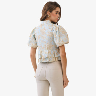 Blue floral peplum top with puff sleeves and collared button front detail styled with neutral high waisted pants