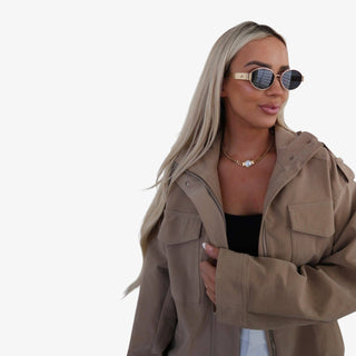 Bella gold coin necklace in 18K gold-plated finish worn on model