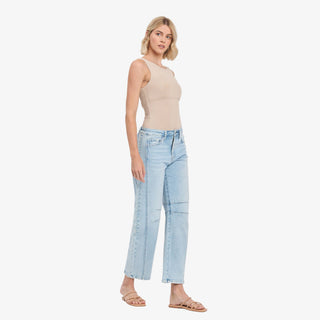 Light wash barrel jeans with high rise waist and curved leg fit
