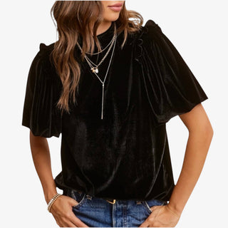 Woman wearing Velvet Whisper Jet Black Top with flutter sleeves and mock neckline
