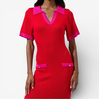 Red dress with pink accents and gold hardware on a white background