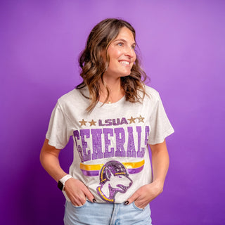 Woman wearing a 'LSUA Generals' t-shirt against a purple background