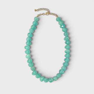 Alt Text
Aqua glass beaded necklace with glossy rounded beads and gold clasp flat lay front view