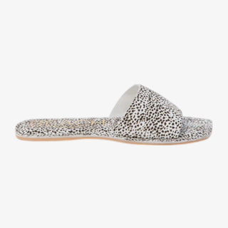 Black and white spot print slide sandal on a white background