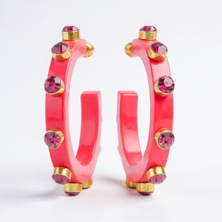 Resin hoop earrings with gold rhinestone accents in fuchsia