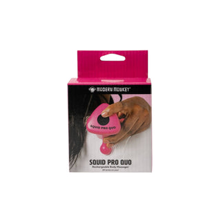 Package of a pink device labeled 'SQUID PRO QUO' held by a person, with a white background.