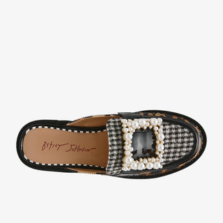 Black loafer with pearl embellishment on a white background