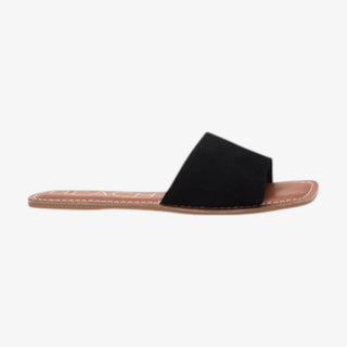 Black sandal with a brown sole on a white background