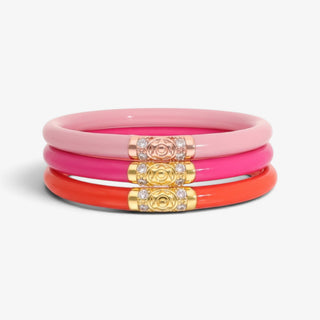 BudhaGirl Valentina Three Kings Bangles set with pink, hot pink and coral all weather bangles featuring crystal-accented gold and rose gold details.