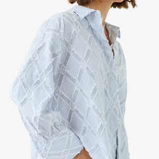 Blue striped textured button down shirt with embroidered fringe detail close side view