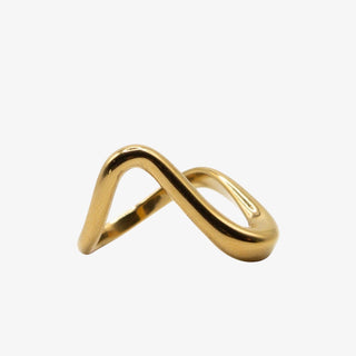 Gold ring with a wavy design on a white background