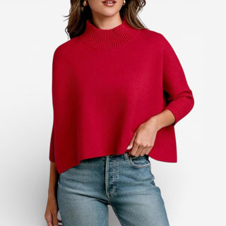 Person wearing a red sweater and blue jeans on a white background
