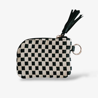 Woven checkered keychain pouches with tassel zipper detail, available in black and ivory or brown and ivory, perfect for cards, cash, or small essentials.