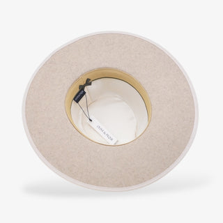 Beige hat with a adjustable band on a white background