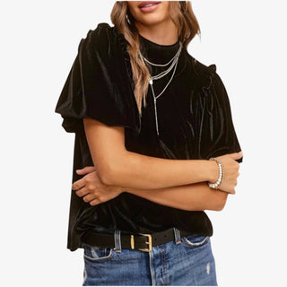Woman wearing Velvet Whisper Jet Black Top with flutter sleeves and mock neckline