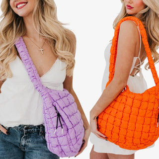women holding a puffy quilted tote bag in orange and lilac