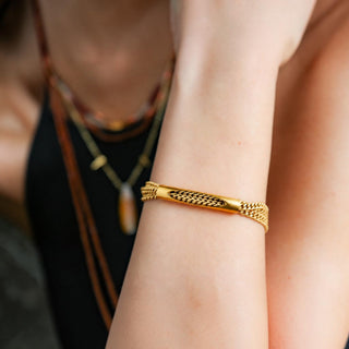 Catherine Page Morgan gold chain bracelet with a cutout tube accent, styled alone on a wrist for everyday wear, close-up view.