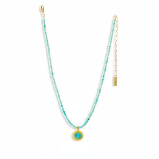 Turquoise gemstone pendant necklace with aqua beaded strand and yellow enamel frame on gold chain front view