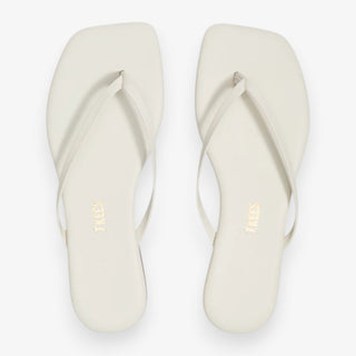 TKEES Lily flip flop sandal in cream with slim thong straps and cushioned flat sole, minimalist everyday sandal on a neutral background