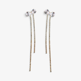 Gold crystal bow duster earrings with sparkling clear rhinestones and long cascading fringe strands, front view on white background.