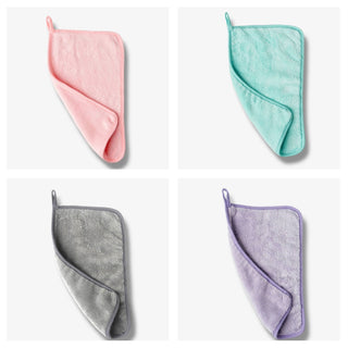 Water Works Makeup Removing Towel in pink, grey, greens and purple on a grey background 